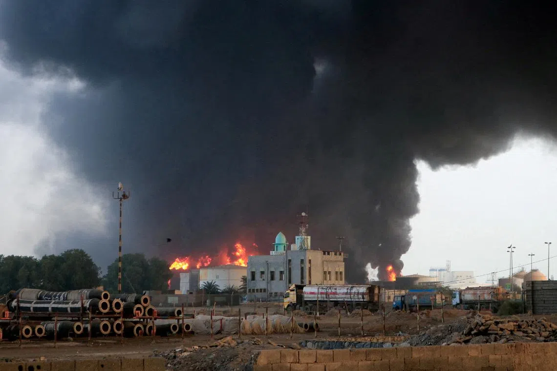 FILE PHOTO: Flames and smoke rise from the site of Israeli air strikes at the port of Hodeidah, Yemen July 21, 2024. REUTERS/Stringer/File Photo