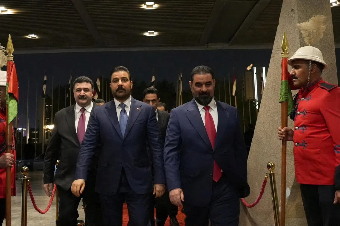 Speaker of Iraq's Parliament Haibat al-Halbousi welcomes Prime Minister Ali al-Zaidi at the parliament building ahead of a session to approve the remaining members of his cabinet, in Baghdad, Iraq, October 15, 2026. Iraqi Prime Minister's Media Office/Handout via REUTERS