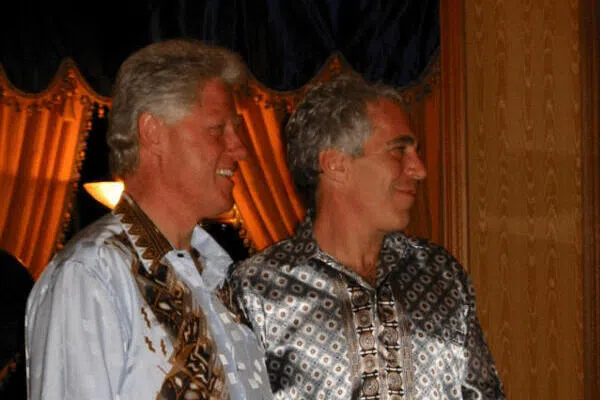 Former US president Bill Clinton standing with Jeffrey Epstein in this image released by the US Department of Justice in Washington DC, on Dec 19.