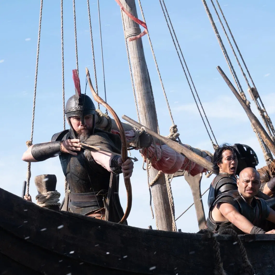 Actor Matt Damon (left, with bow) is Odysseus in The Odyssey.