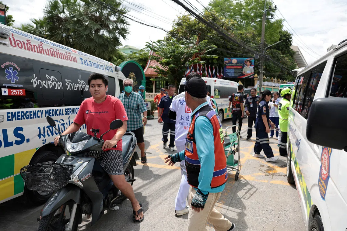 Emergency personnel gathering outside Debsirin Nonthaburi School on Aug 7.