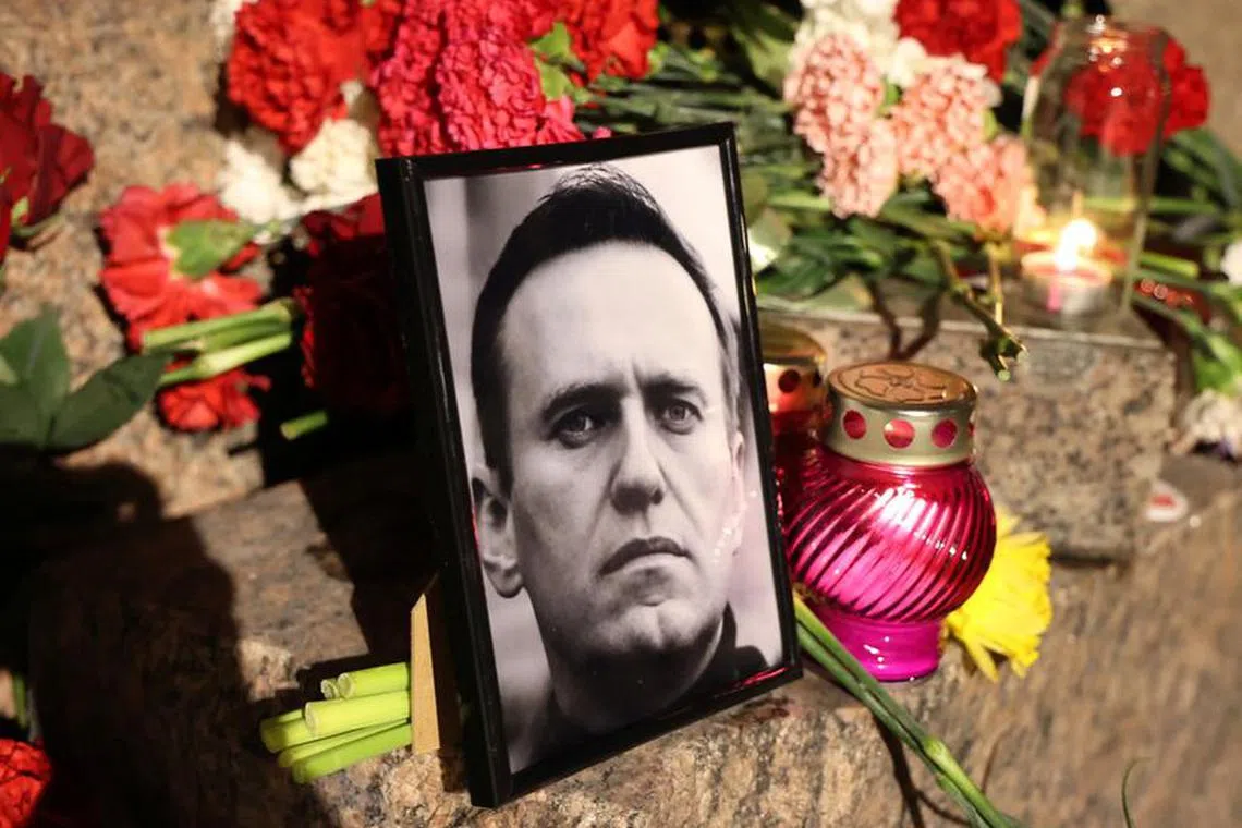 A portrait of Russian opposition leader Alexei Navalny is placed at the monument to the victims of political repressions following Navalny's death, in Saint Petersburg, Russia February 16, 2024. REUTERS/Stringer