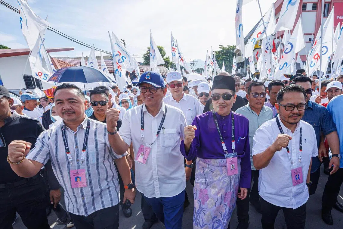 hzsabah - Sabah caretaker Chief Minister Hajiji Noor marching with party supporters to the nomination centre ahead of a crowded, dynasty-driven state election.

Credit: THE STAR/ANN