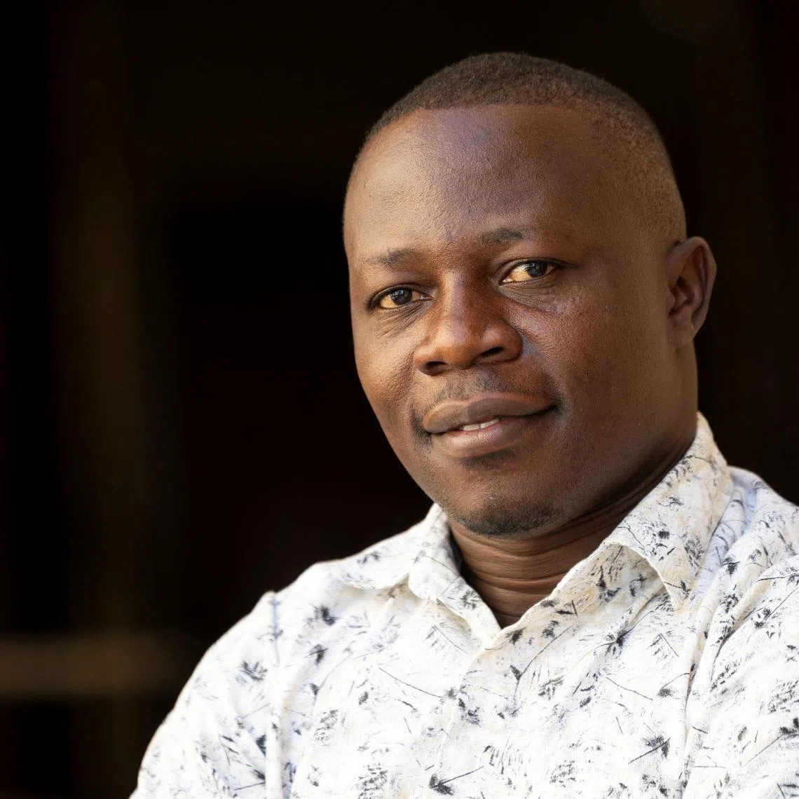 Edward Mukiibi, President of global \"Slow Food\" movement, poses for pictures at the end of an exclusive interview with Reuters in Rome, Italy, July 9, 2026. REUTERS/Remo Casilli