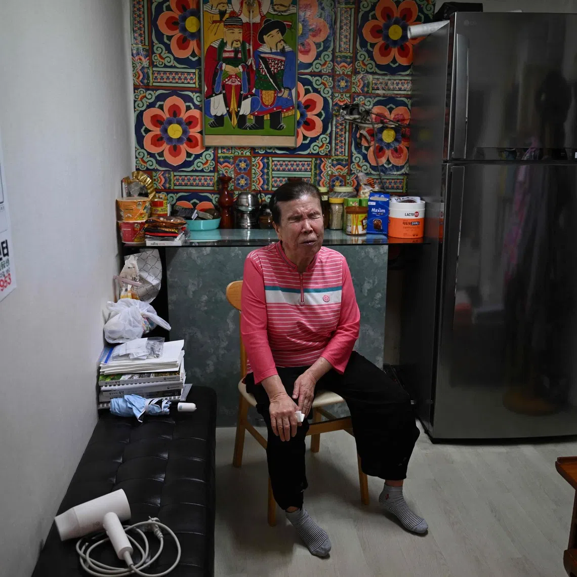 Blind fortune-teller Song Oh-soon speaks at her small practice in the Mia-ri fortune-telling village in Seoul.