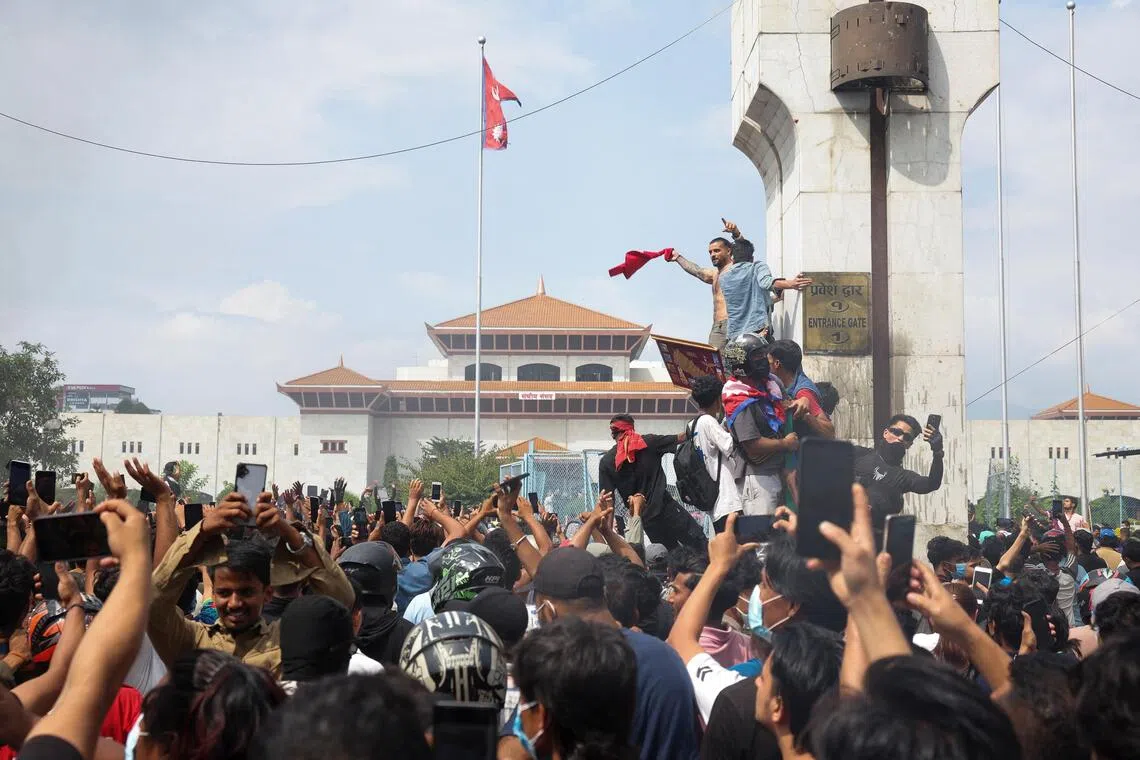 Demonstrators enter Parliament during a protest against Monday's killing of 19 people after anti-corruption protests that were triggered by a social media ban, which was later lifted, during a curfew in Kathmandu, Nepal, September 9, 2025. REUTERS/Adnan Abidi