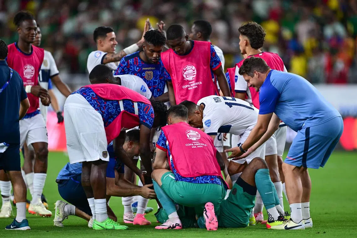 Ecuador players celebrating after their 0-0 Copa America Group B draw with Mexico at State Farm Stadium on June 30.