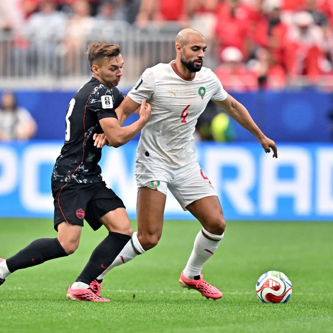 FILE PHOTO: Soccer Football - FIFA World Cup 2026 - Round of 16 - Canada v Morocco - Houston Stadium, Houston, Texas, U.S. - July 4, 2026 Morocco's Sofyan Amrabat in action with Canada's Niko Sigur IMAGN IMAGES via Reuters/Maria Lysaker/File Photo