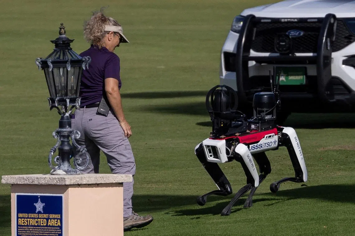A Secret Service officer interacts with Spot, a robot dog, at US President-elect Donald Trump's residence at Mar-a-Lago in Palm Beach, Florida, on Nov 12.