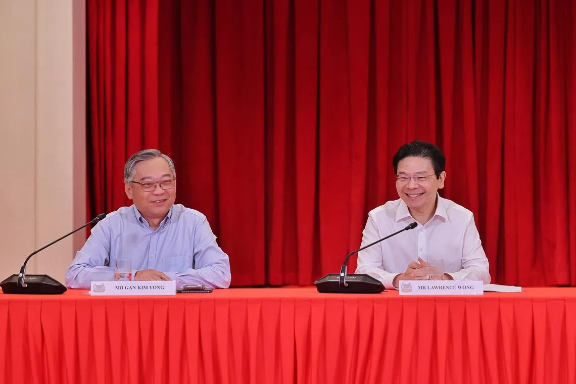 Minister for Trade and Industry Gan Kim Yong (left) and DPM Lawrence Wong at a press conference announcing the new Cabinet line-up on May 13.