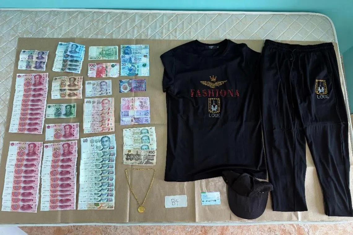 A gold necklace, $1,311 in cash and 10,050 yuan (S$1,800) were seized.