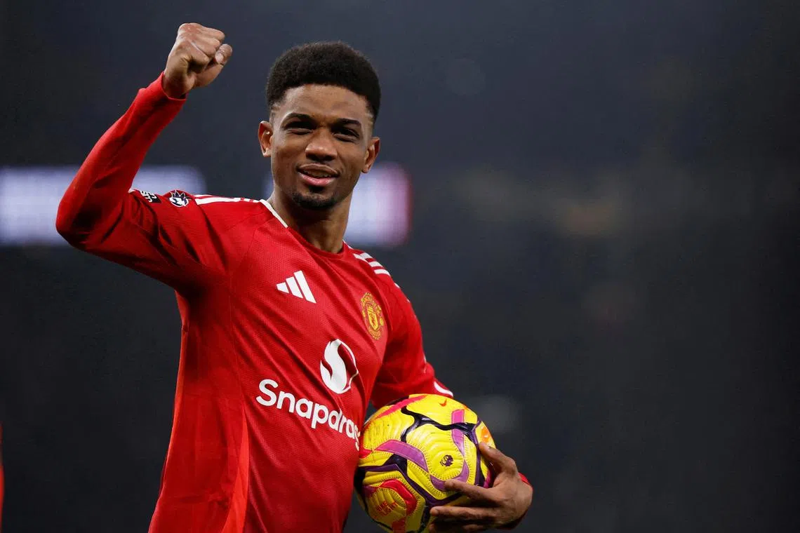Soccer Football - Premier League - Manchester United v Southampton - Old Trafford, Manchester, Britain - January 16, 2025 Manchester United's Amad Diallo celebrate after the match as he holds the match ball after scoring a hat trick Action Images via Reuters/Jason Cairnduff