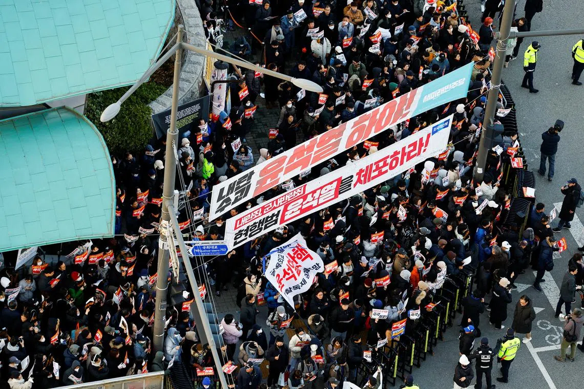 Protesters demanding the impeachment of South Korean President Yoon Suk Yeol, who declared martial law, which was reversed hours later, gather in front of the National Assembly in Seoul, South Korea, December 6, 2024. REUTERS/Kim Kyung-Hoon/File Photo