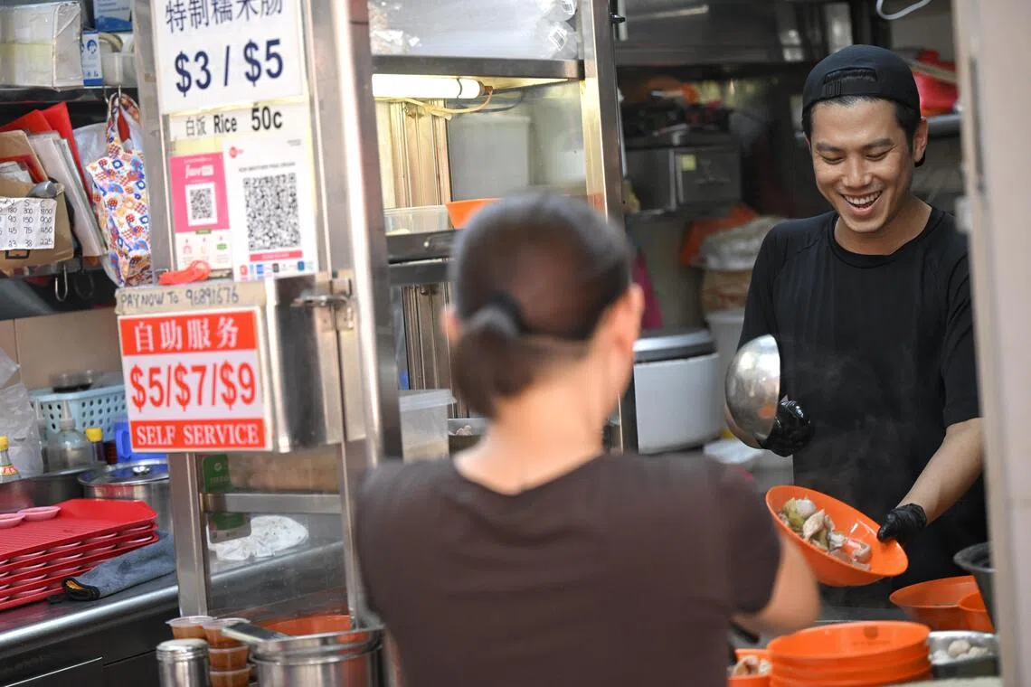 Thomas Koh (right), a third generation hawker at Koh Brothers pig organ soup.