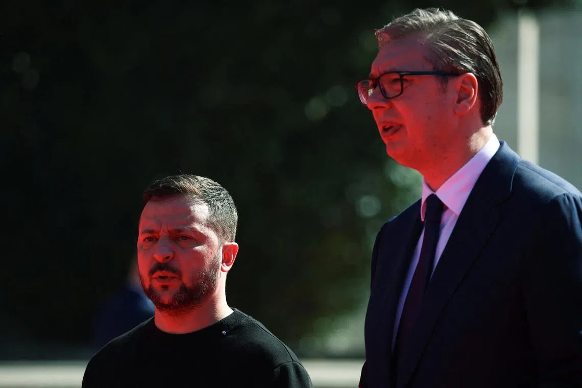 Ukrainian President Volodymyr Zelenskiy and Serbian President Aleksandar Vucic react on the day of the Ukraine Southeast Europe Summit in Tirana, Albania, February 28, 2024. REUTERS/Florion Goga