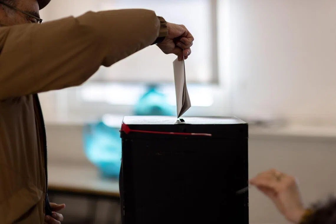 Exit polls and first partial results showed two candidates are heading into a runoff in February.