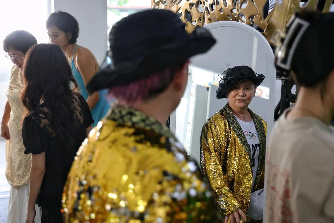 Seng Lee Khoon, 68, admiring her makeover at the Sing, Shine, Share event on Aug 29.