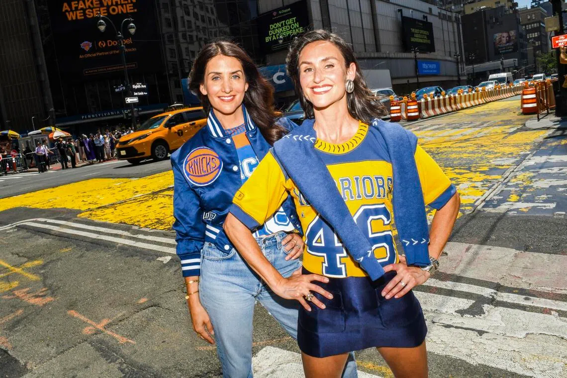 From left, sisters Jodie and Danielle Snyder, founders of DannijoPro, outside Madison Square Garden in New York, May 18, 2026. The Snyder sisters founded DannijoPro to cater to the growing number of women sports fans, many of whom don’t want standard logo tees and hoodies. 