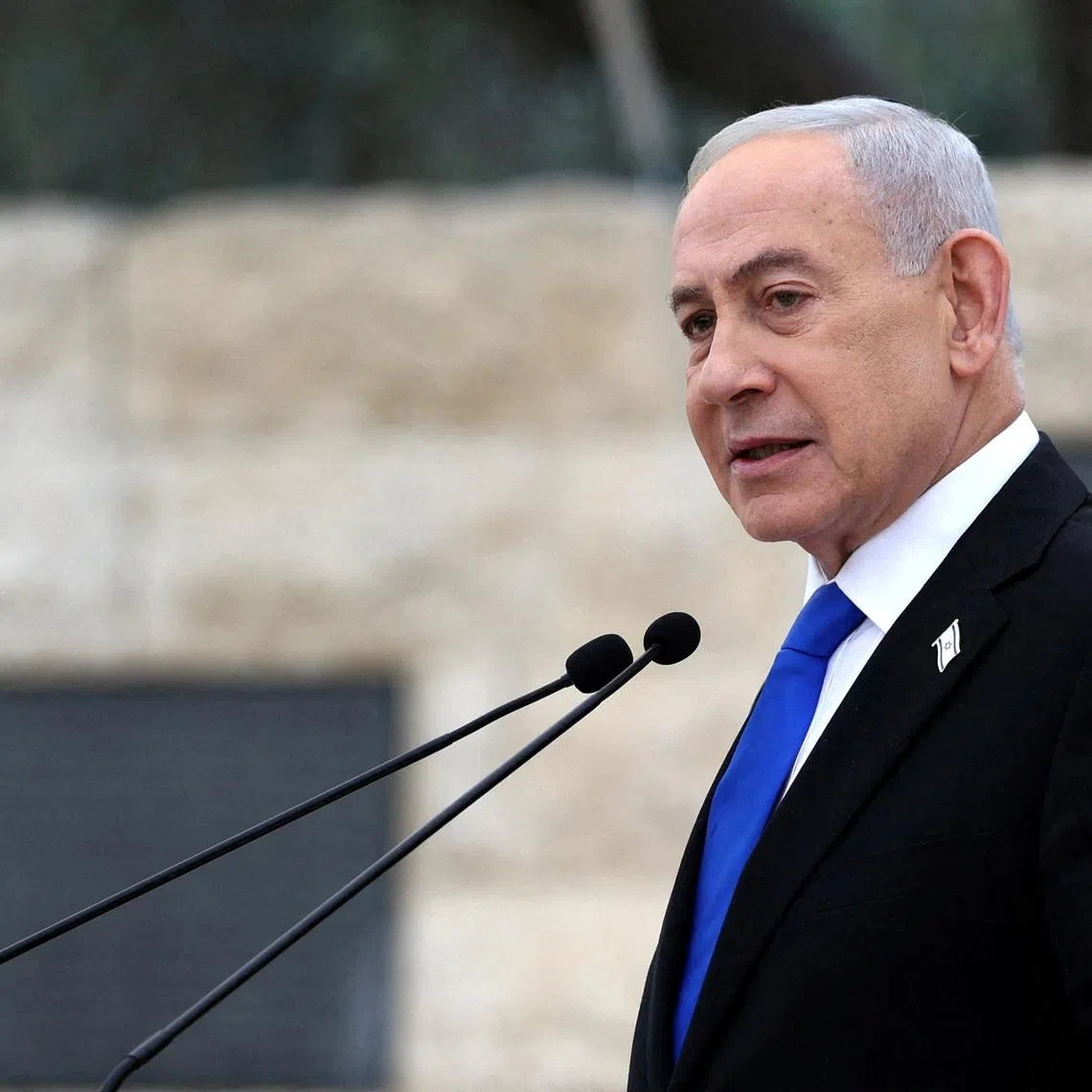 FILE PHOTO: Israel’s Prime Minister Benjamin Netanyahu speaks during a ceremony commemorating Israel’s Remembrance Day for fallen soldiers, or Yom HaZikaron, at the Military Cemetery on Mount Herzl in Jerusalem April 21, 2026. ILIA YEFIMOVICH/Pool via REUTERS/File Photo