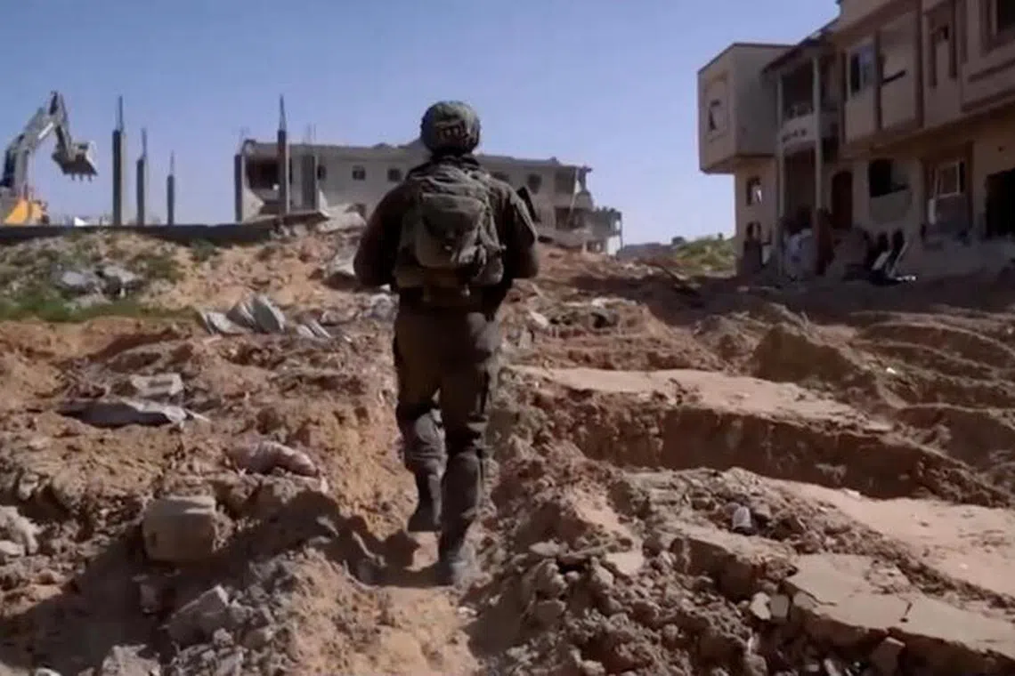 Footage released by the Israeli Army says to show Israeli soldiers conducting operations in a location given as Tel Al-Sultan area, Rafah Governorate, Gaza, in this still image taken from an undated handout video, released April 2, 2025. Israeli Army/Handout via REUTERS THIS IMAGE HAS BEEN SUPPLIED BY A THIRD PARTY