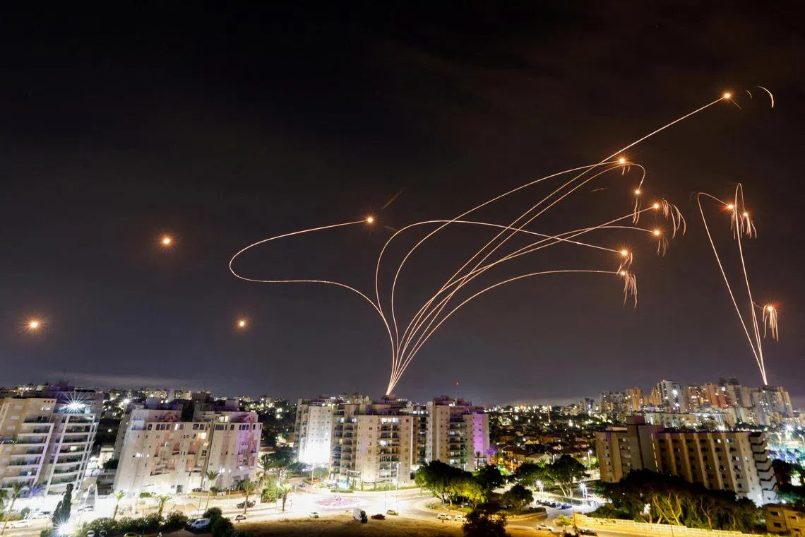 Israel's Iron Dome anti-missile system intercepts rockets launched from the Gaza Strip, as seen from the city of Ashkelon, Israel, on Oct 9.