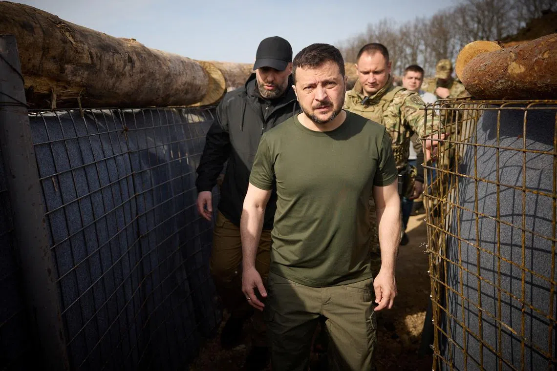 Ukraine's President Volodymyr Zelenskiy inspects new fortifications for Ukrainian servicemen, amid Russia's attack on Ukraine, near Russian border in Kharkiv region, Ukraine, April 9, 2024. Ukrainian Presidential Press Service/Handout via REUTERS/ File Photo
