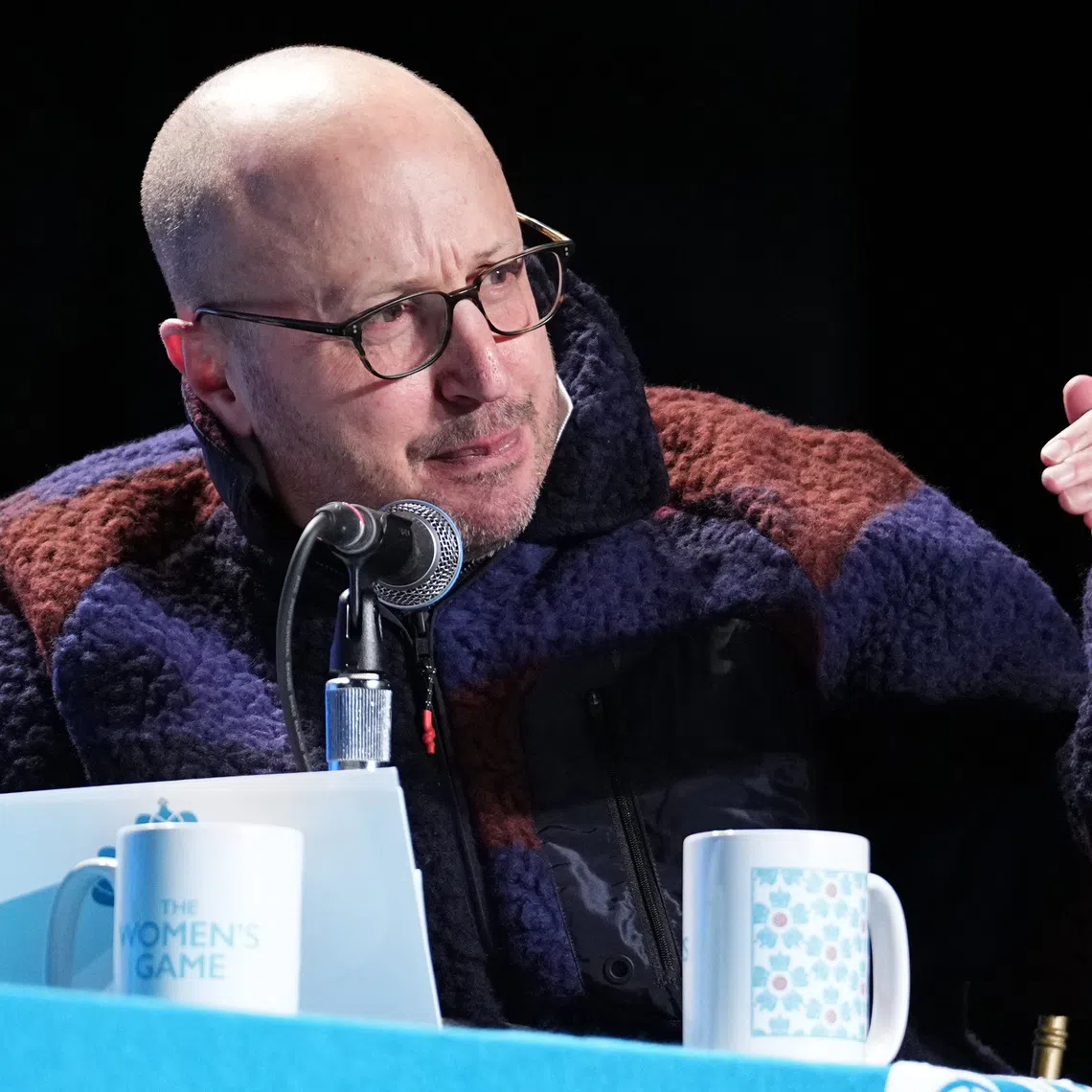 Nov 21, 2024; Kansas City, Missouri, USA; Men in Blazers podcast host Roger Bennett on stage during The Night of 1000 Stars ahead of the 2024 NWSL Championship match at The Madrid Theatre. Mandatory Credit: Denny Medley-Imagn Images