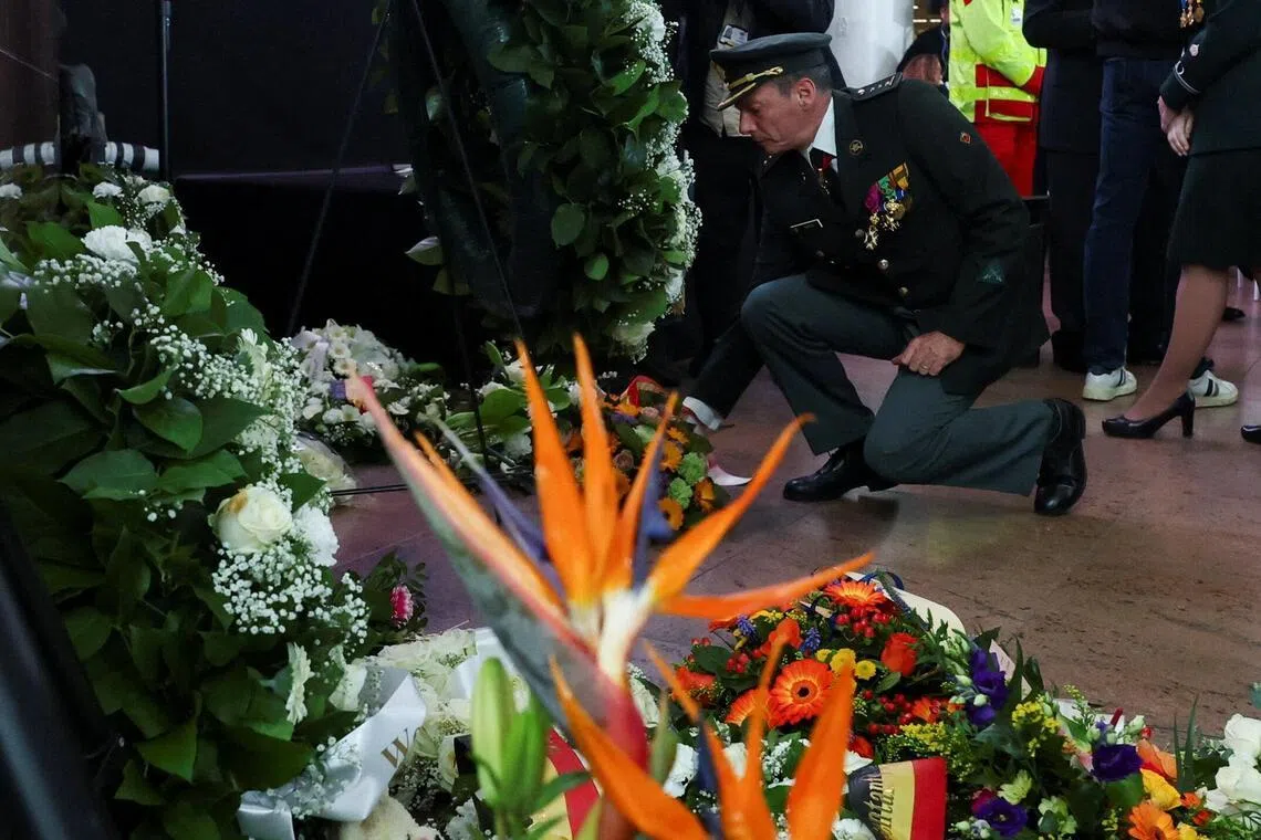 A man laying flowers at Brussels Airport in Zaventem, Belgium on March 22.