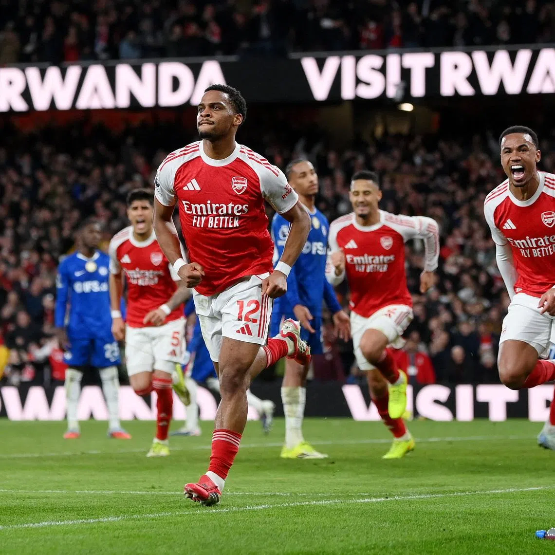 Soccer Football - Premier League - Arsenal v Chelsea - Emirates Stadium, London, Britain - March 1, 2026 Arsenal's Jurrien Timber celebrates scoring their second goal with Gabriel Magalhaes REUTERS/Jaimi Joy