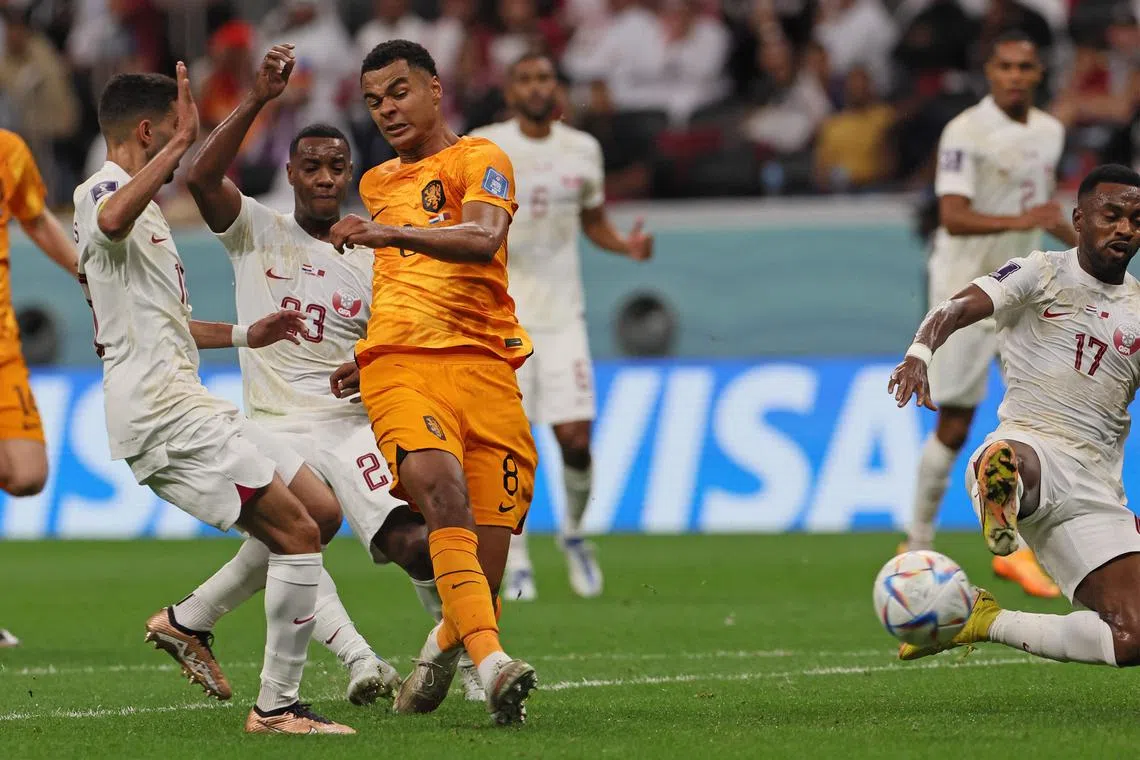 The Netherlands'  Cody Gakpo scoring the opening goal in their 2-0 win over Qatar.