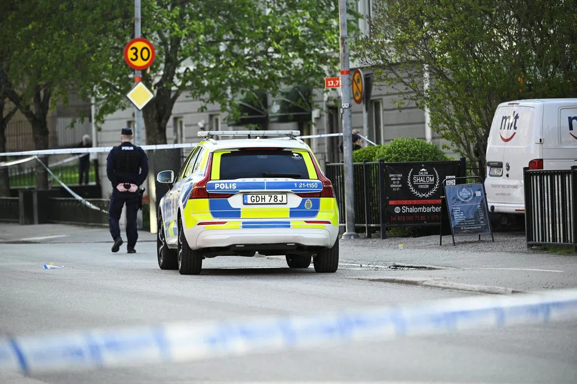 A Police officer works near the scene where several people were injured after a series of loud bangs that indicated gunfire, according to police, at Vaksala Square in Uppsala, Sweden, April 29, 2025. TT News Agency/Fredrik Sandberg via REUTERS