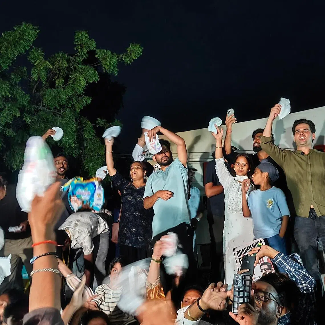 Abhijeet Dipke and other representatives of the Cockroach Janta Party holding diapers at a protest in New Delhi on June 23 against exam paper leaks. Credit: Debarshi Dasgupta