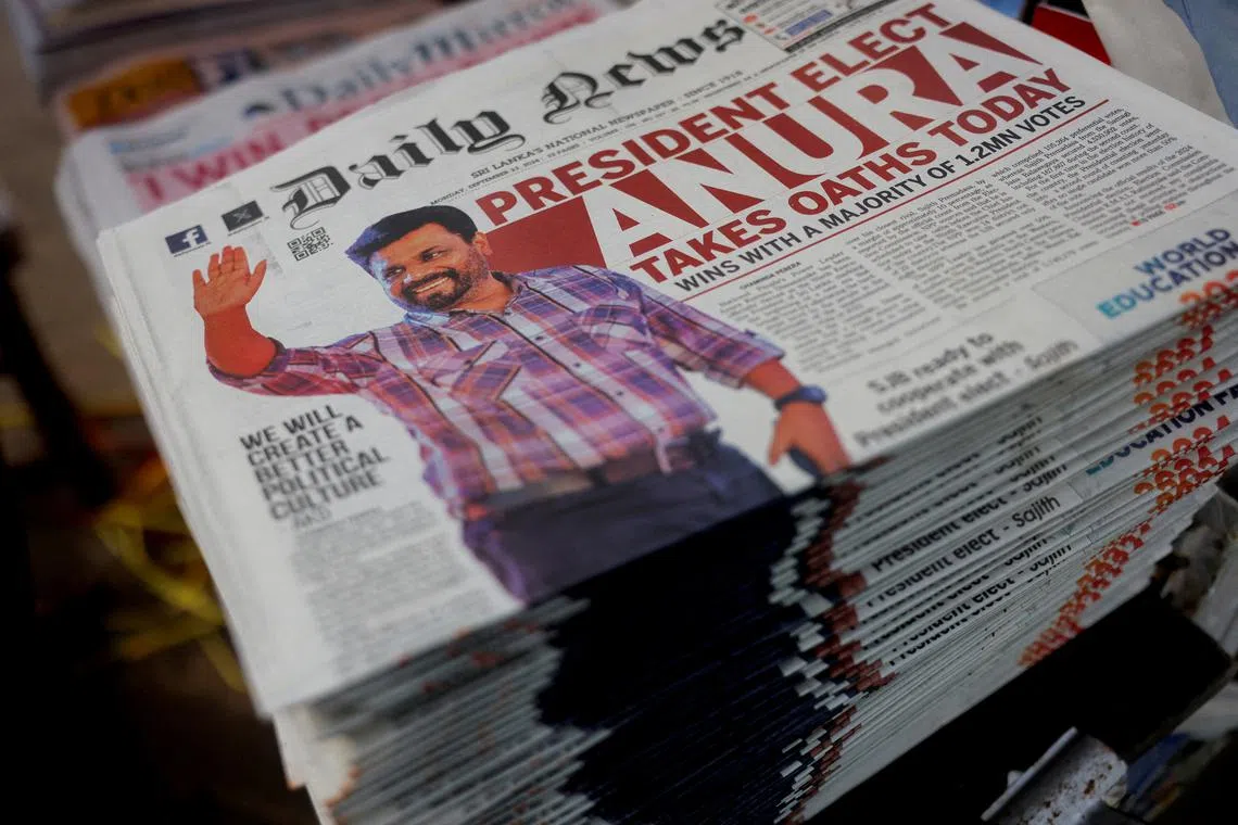 The frontpage of a newspaper placed on a stack shows an image of Anura Kumara Dissanayake from the National People's Power (NPP) alliance who is elected as new president of Sri Lanka after his victory in the presidential election, in Colombo, Sri Lanka, September 23, 2024. REUTERS/Dinuka Liyanawatte/File Photo