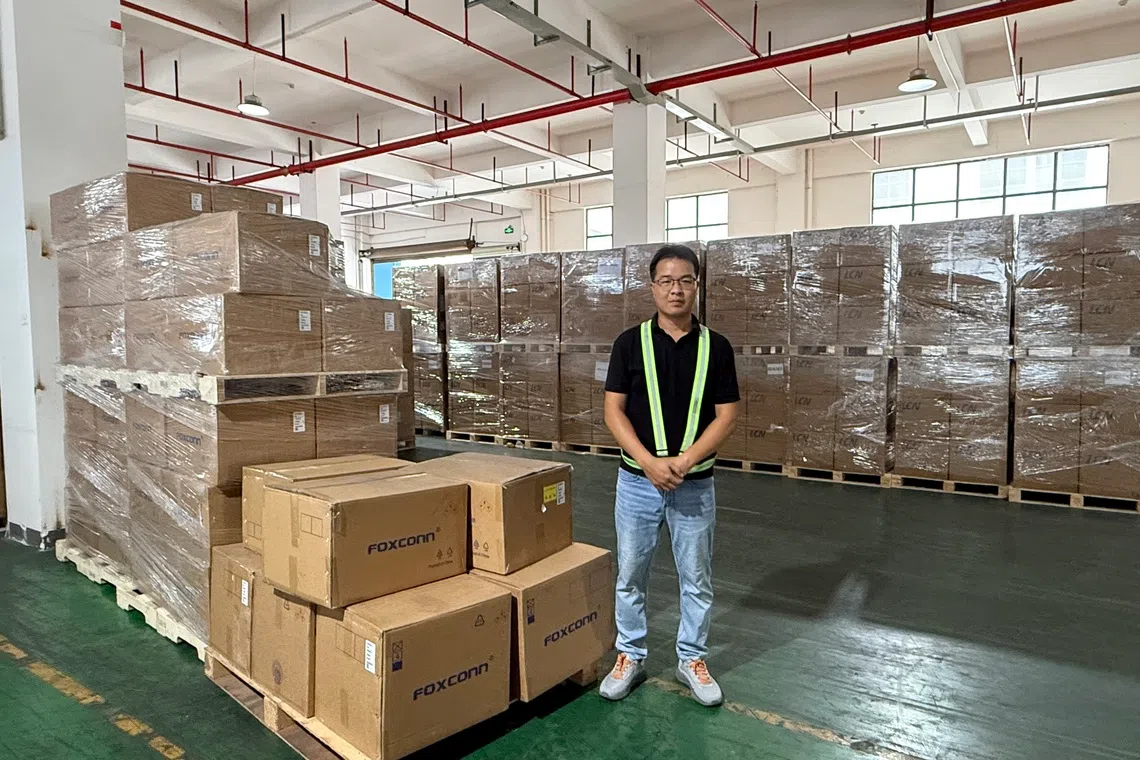 Li Anzhang supervises a warehouse for logistics company Chefuwang in Pingxiang, China, which sends goods to factories in Vietnam.