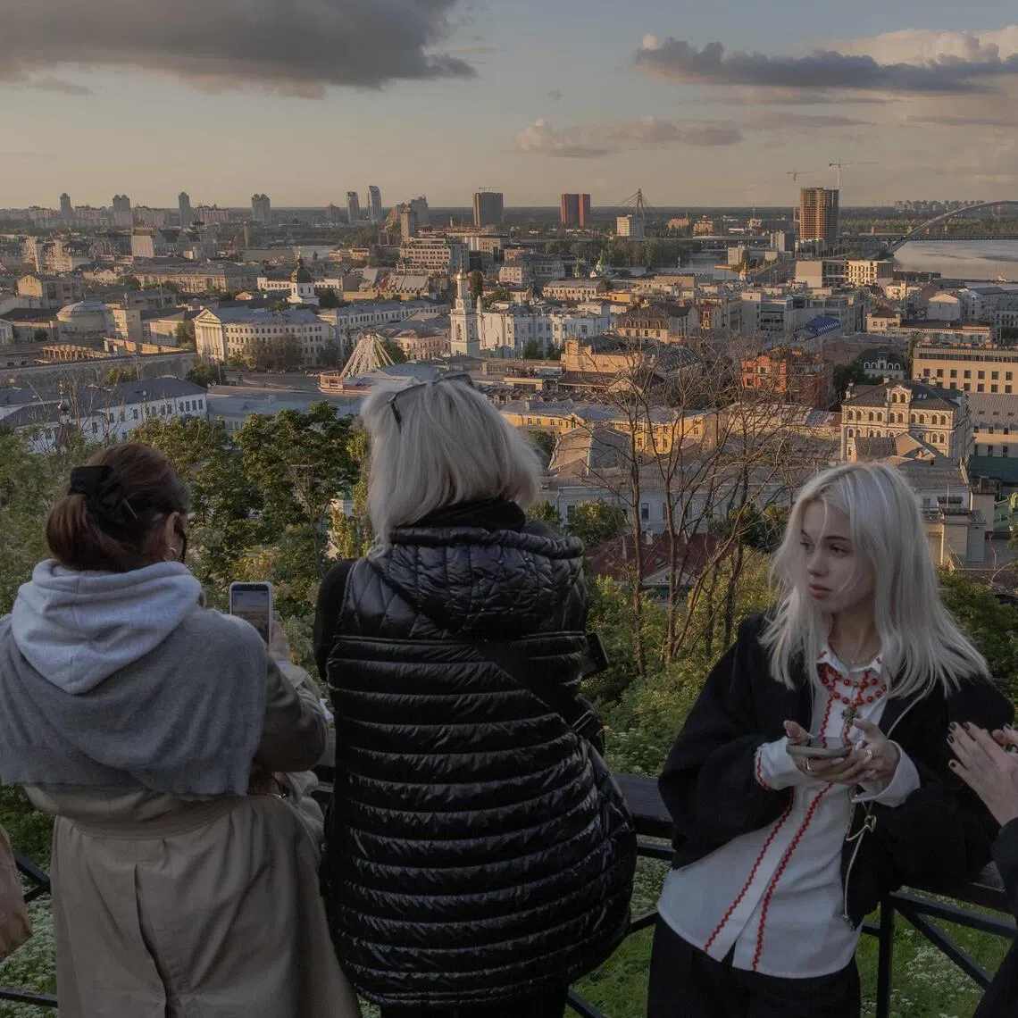 Visitors at an observation area overlooking the Podil neighbourhood in Kyiv on May 31 amid the Russian invasion of Ukraine.