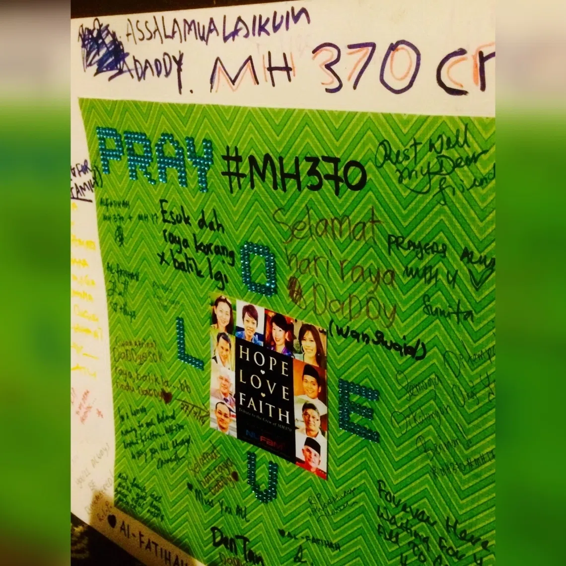 A card featuring pictures of the missing MH370 flight's cabin crew with wishes from their relatives, at a remembrance event just outside Kuala Lumpur in 2015.
