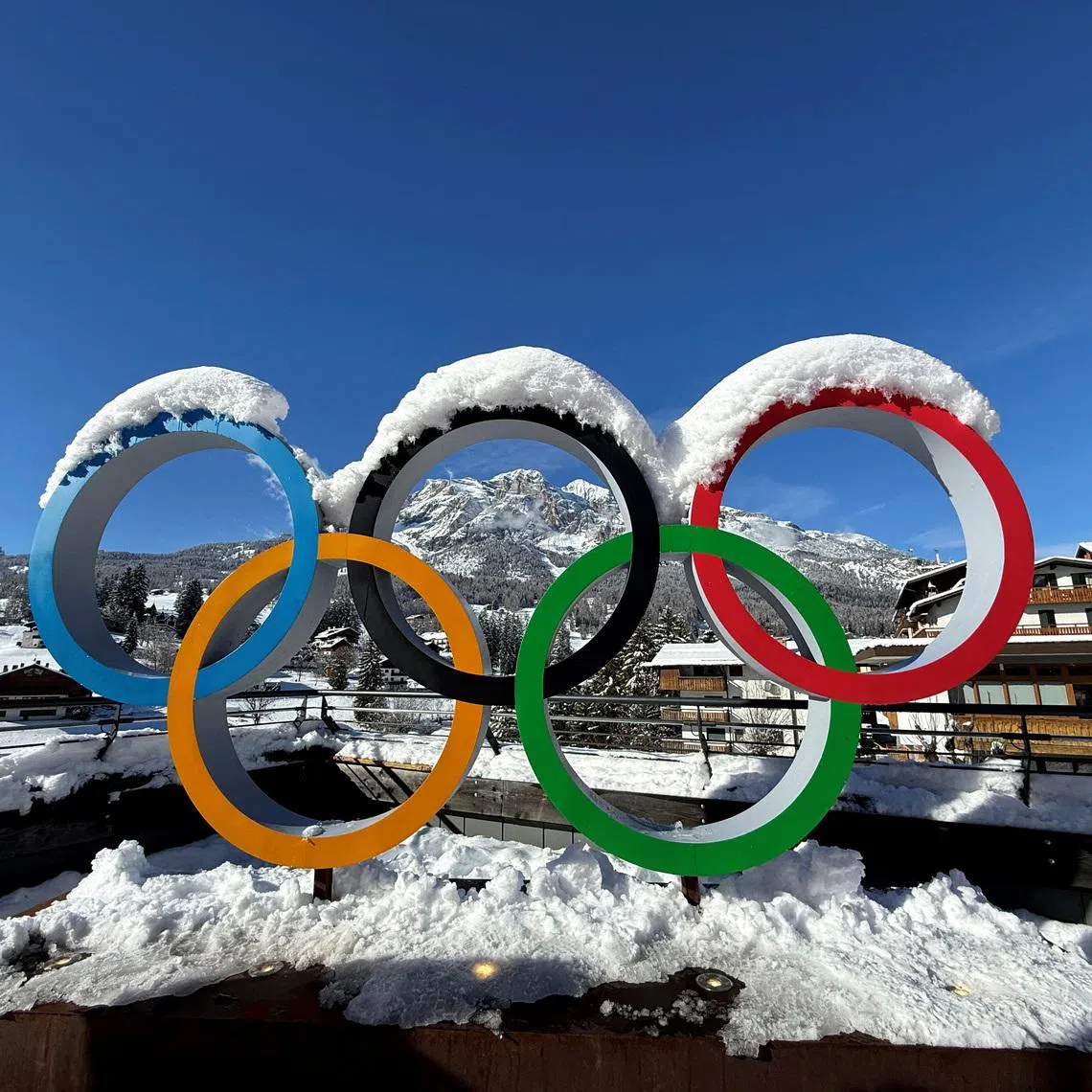 FILE PHOTO: Milano Cortina 2026 Winter Olympics - Previews - Cortina d'Ampezzo, Italy - January 26, 2026 General view of the Olympic rings covered in snow ahead of the Milano Cortina 2026 Winter Olympics REUTERS/Peter Jebautzke/File Photo