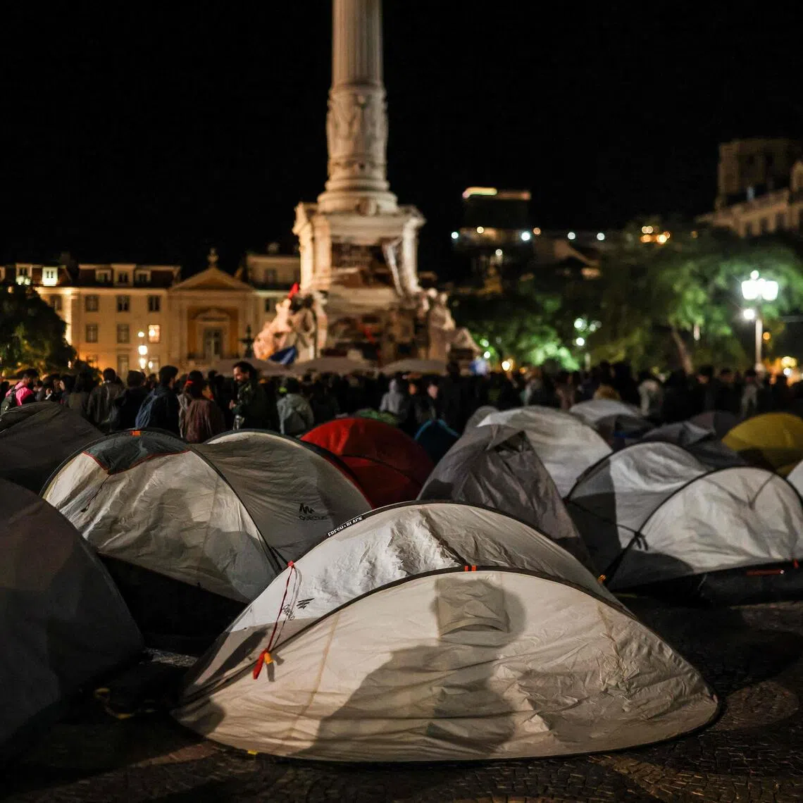 An encampment set up in protest against housing shortages, soaring rents and low wages, at Rossio square in central Lisbon late on Oct 19.