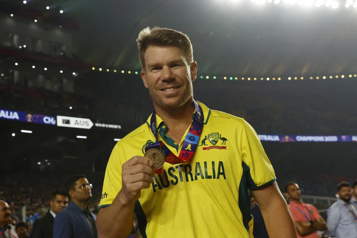Cricket - ICC Cricket World Cup 2023 - Final - India v Australia - Narendra Modi Stadium, Ahmedabad, India - November 19, 2023 Australia's David Warner celebrates with his medal after winning the ICC Cricket World Cup REUTERS/Adnan Abidi/ File Photo