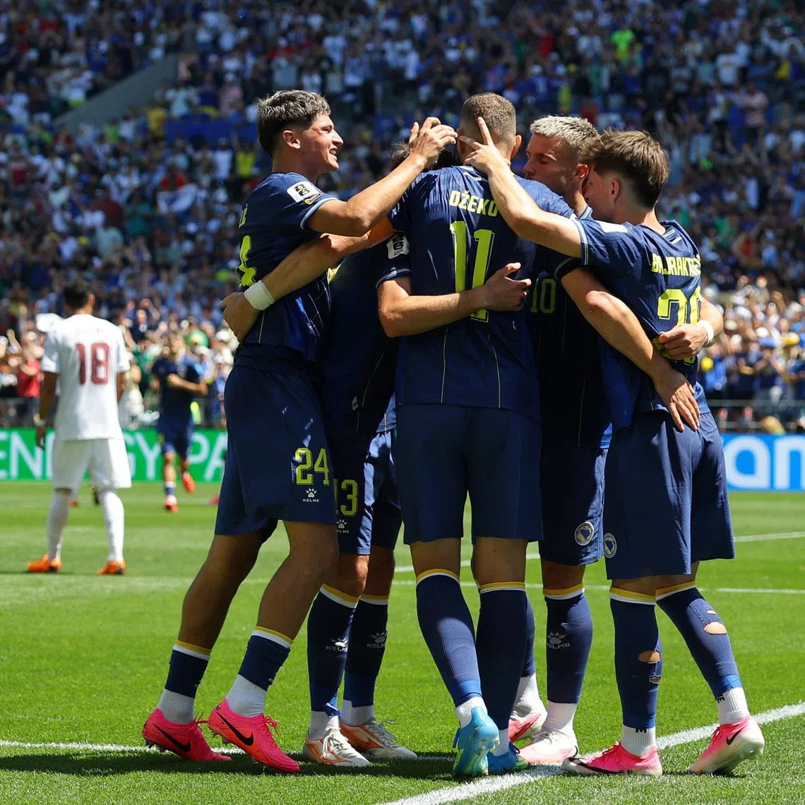 Soccer Football - FIFA World Cup 2026 - Group B - Bosnia and Herzegovina v Qatar - Seattle Stadium, Seattle, Washington, U.S. - June 24, 2026 Bosnia and Herzegovina's Edin Dzeko and teammates celebrate their second goal, an own goal scored by Qatar's Sultan Albrake REUTERS/Carlos Barria