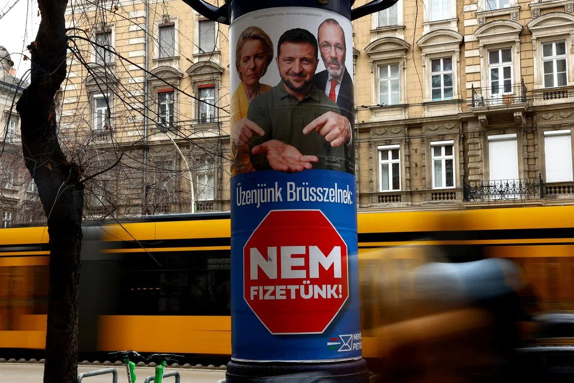 A government election billboard shows European Commission President Ursula von der Leyen, Ukraine's President Volodymyr Zelenskiy and European People's Party (EPP) President Manfred Weber in Budapest, Hungary, February 11, 2026. The billboard reads: \"Our message to Brussels is that we will not pay\". REUTERS/Bernadett Szabo