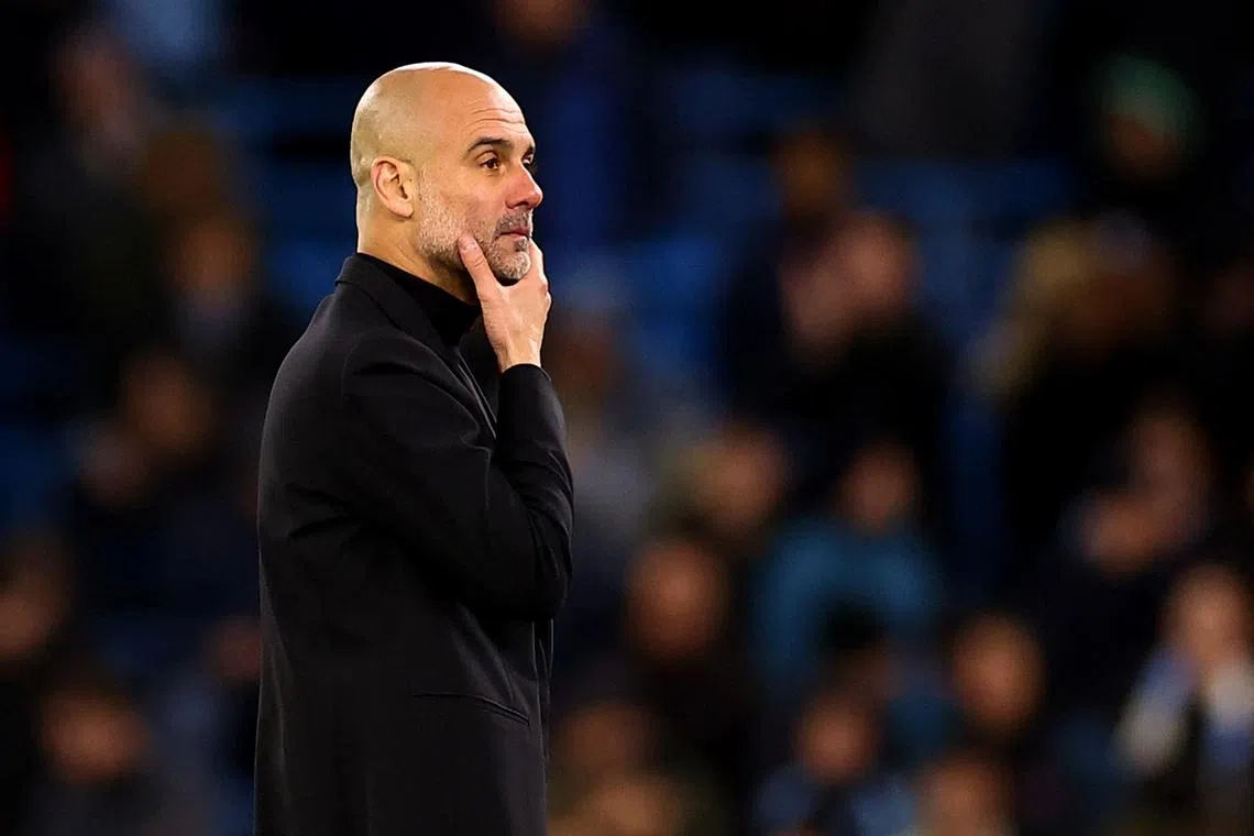 Soccer Football - Champions League - Quarter Final - Second Leg - Manchester City v Real Madrid - Etihad Stadium, Manchester, Britain - April 17, 2024 Manchester City manager Pep Guardiola reacts during the penalty shootout REUTERS/Carl Recine