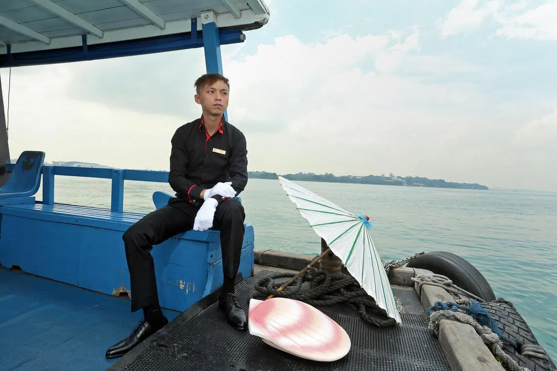 A private operator for sea burials, Nicky Teo of Funeral Solutions, with items used for a sea burial.