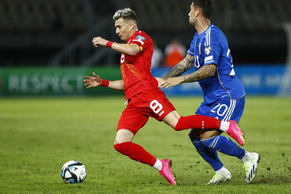 Soccer Football - Euro 2024 Qualifier - Group C - North Macedonia v Italy - Tose Proeski Arena, Skopje, North Macedonia - September 9, 2023 North Macedonia's Ezgjan Alioski in action with Italy's Mattia Zaccagni REUTERS/Ognen Teofilovski