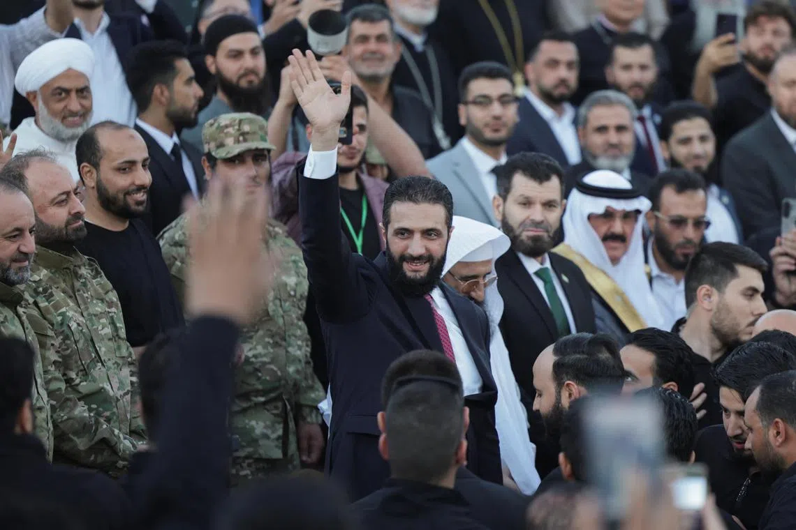Syria’s interim President Ahmed al-Sharaa waves as he attends the “Aleppo, Key to Victory” celebration marking Syria’s liberation, in Aleppo, Syria May 27, 2025. REUTERS/Khalil Ashawi