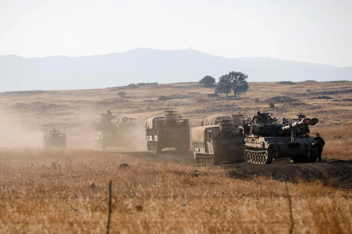 Israeli soldiers reposition military vehicles during a drill in the annexed Golan Heights on July 17.