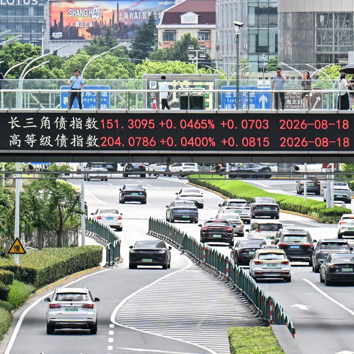 Stock prices on a screen along a bridge in Shanghai’s financial district. China’s anti-corruption campaign led by President Xi Jinping has brought down huge numbers of officials.