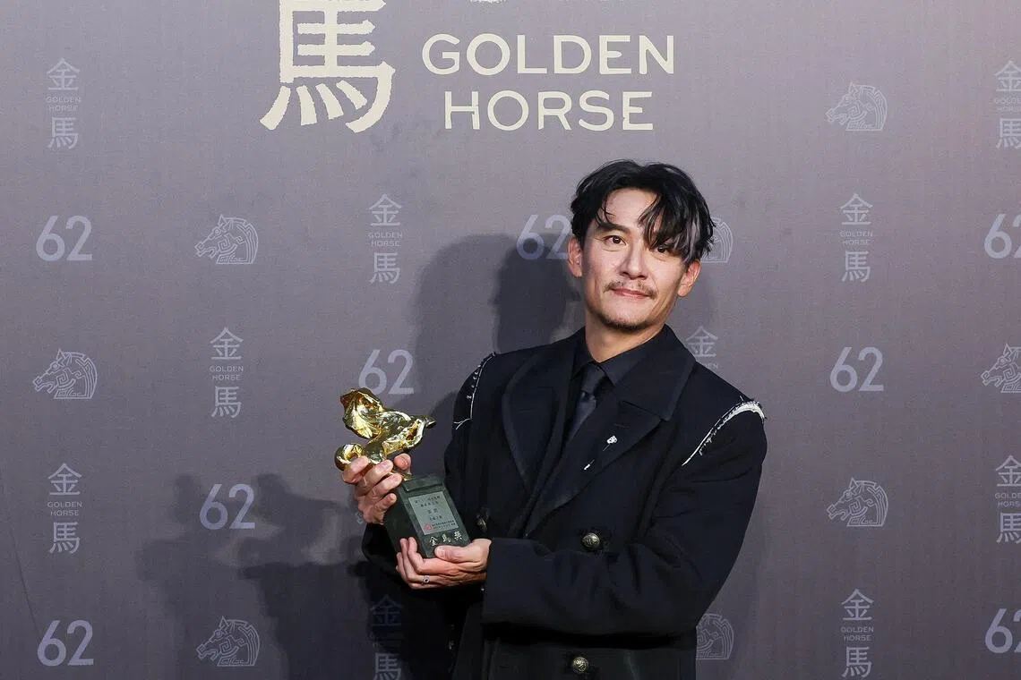 Taiwanese actor Chang Chen poses after winning best leading actor for the movie Lucky Lu.