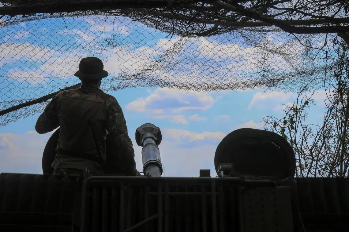 FILE PHOTO: A Ukrainian serviceman prepares to fire a 2S1 Gvozdika self-propelled howitzer towards Russian troops, amid Russia's attack on Ukraine, at a position in the Donetsk region, Ukraine May 21, 2024. REUTERS/Oleksandr Ratushniak/File Photo