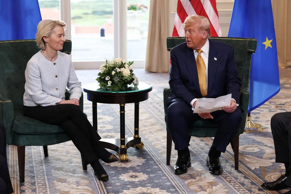 FILE PHOTO: U.S. President Donald Trump sits with European Commission President Ursula von der Leyen, after the announcement of a trade deal between the U.S. and EU, in Turnberry, Scotland, Britain, July 27, 2025. REUTERS/Evelyn Hockstein/File Photo